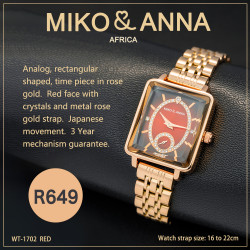 WT-1702 red Watch Analog, rectangular shaped, time piece in rose gold.  Red face with crystals and metal rose gold strap.  Japanese movement.